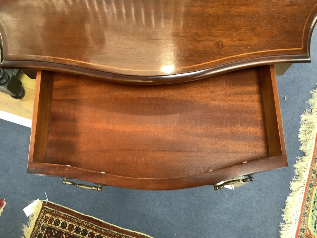 A reproduction mahogany serpentine console table, width 98cm, depth 46cm, height 73cm